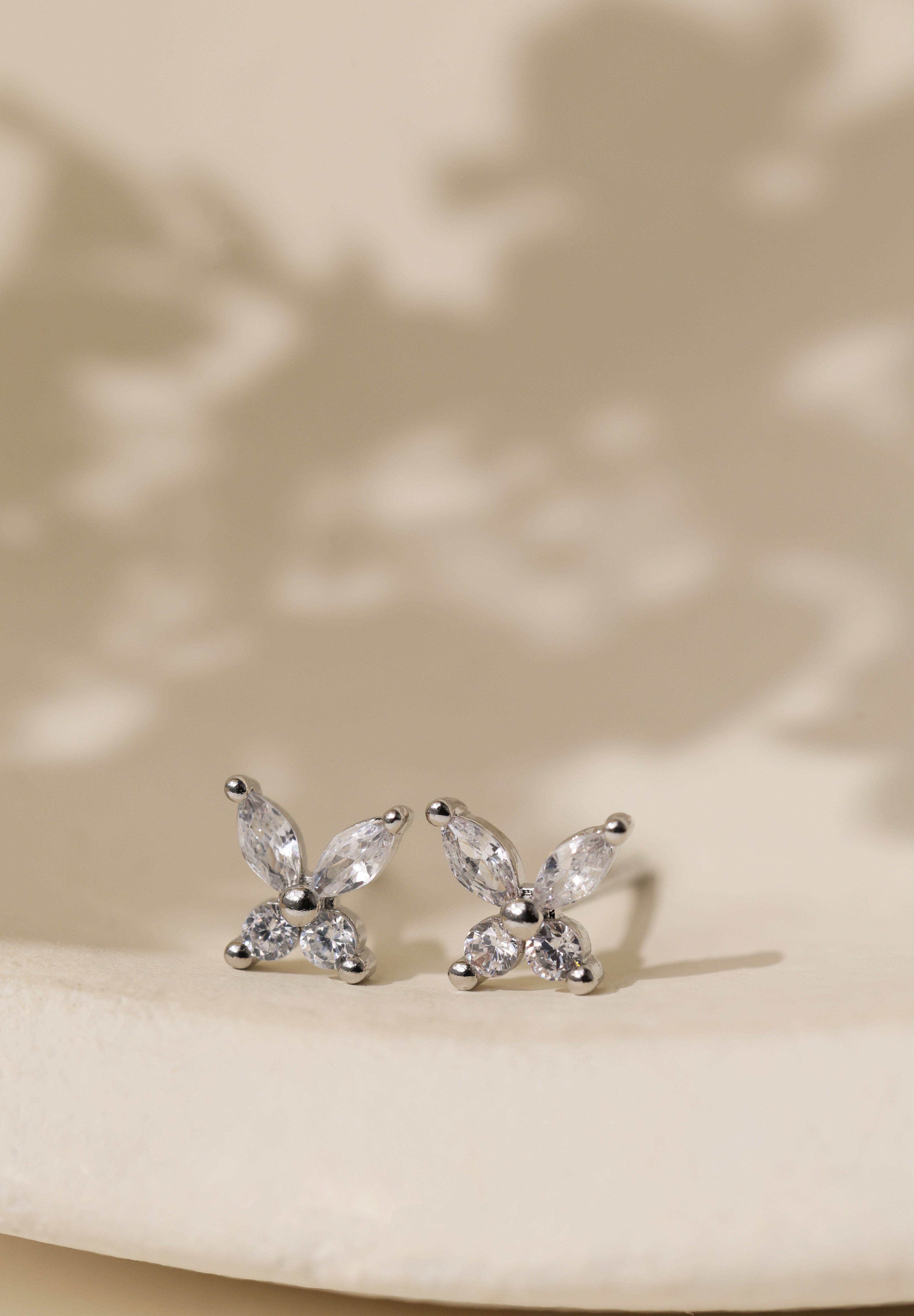Silver butterfly cubic zirconia stud earrings, shown with their 925 sterling silver butterfly backs.