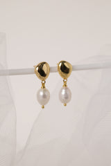 Vivienne gold pearl drop stud earrings — detail of the polished drop and butterfly back