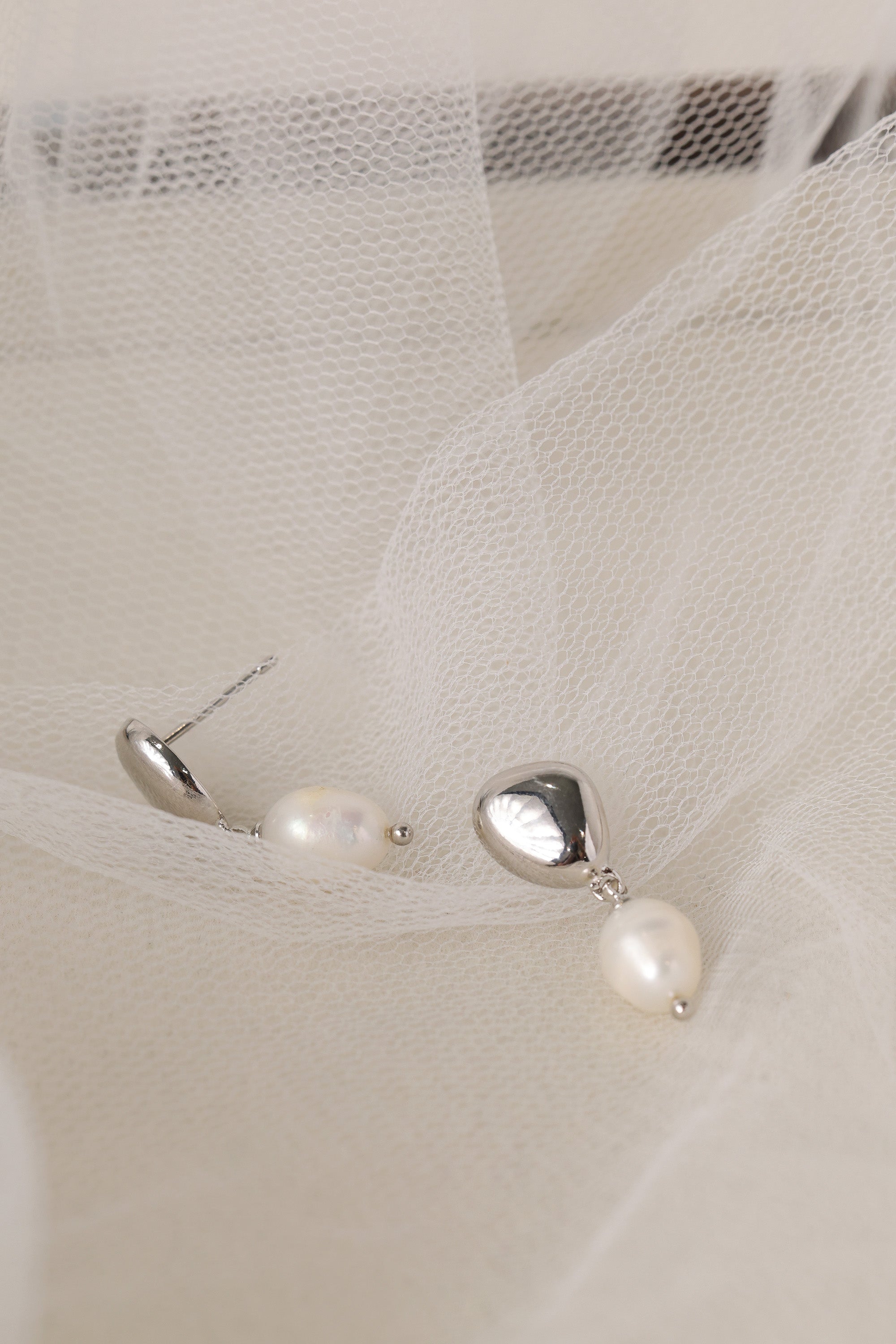 Vivienne silver pearl drop stud earrings — close-up of the freshwater pearl