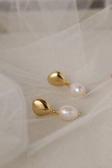 Vivienne gold pearl drop stud earrings — side view