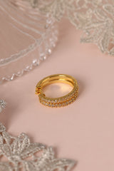 25mm gold hoop earrings with cubic zirconia stones that reflect light, shown as a versatile everyday jewellery piece.”