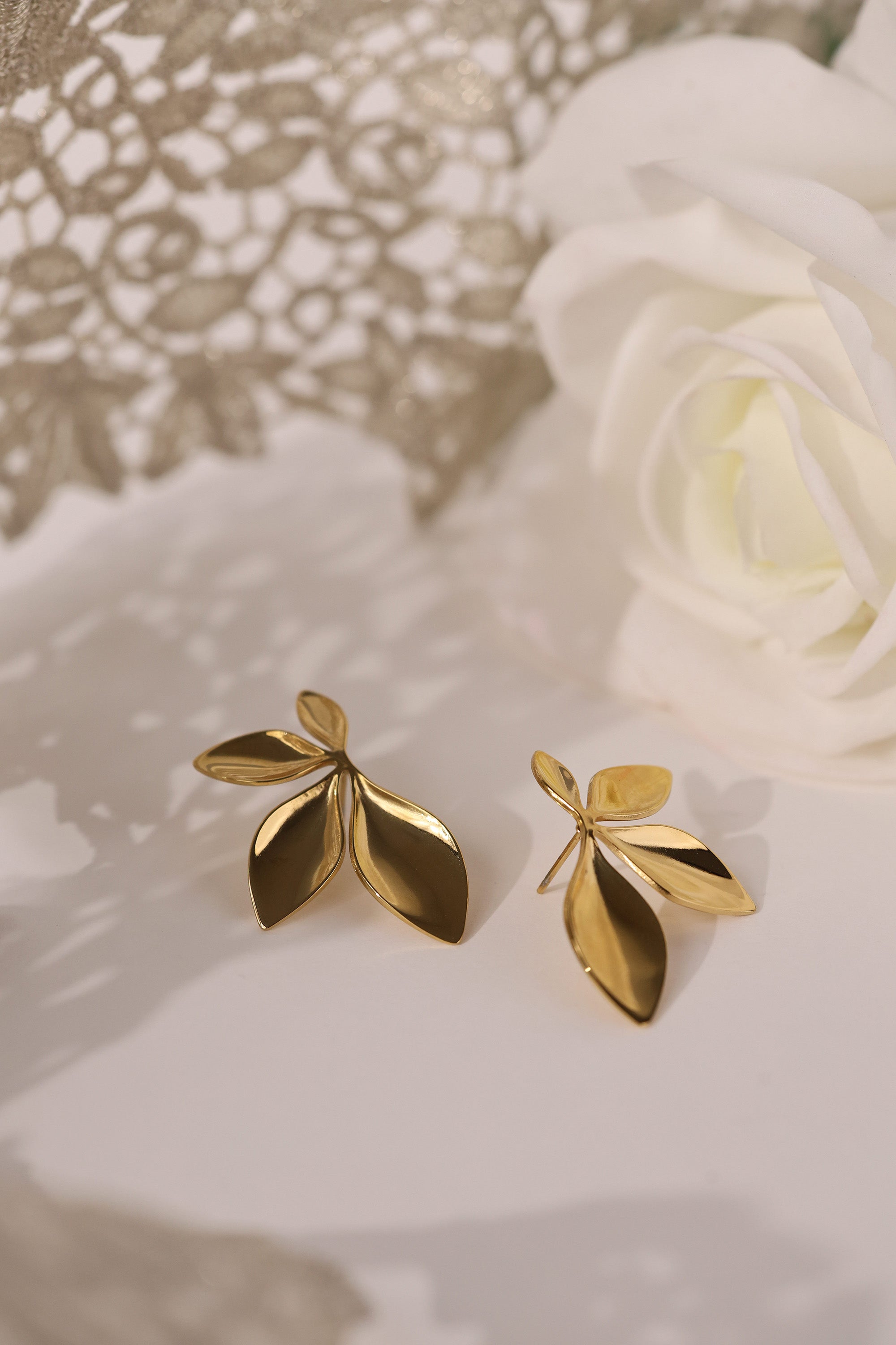 Gold stainless steel leaf‑shaped stud earrings
