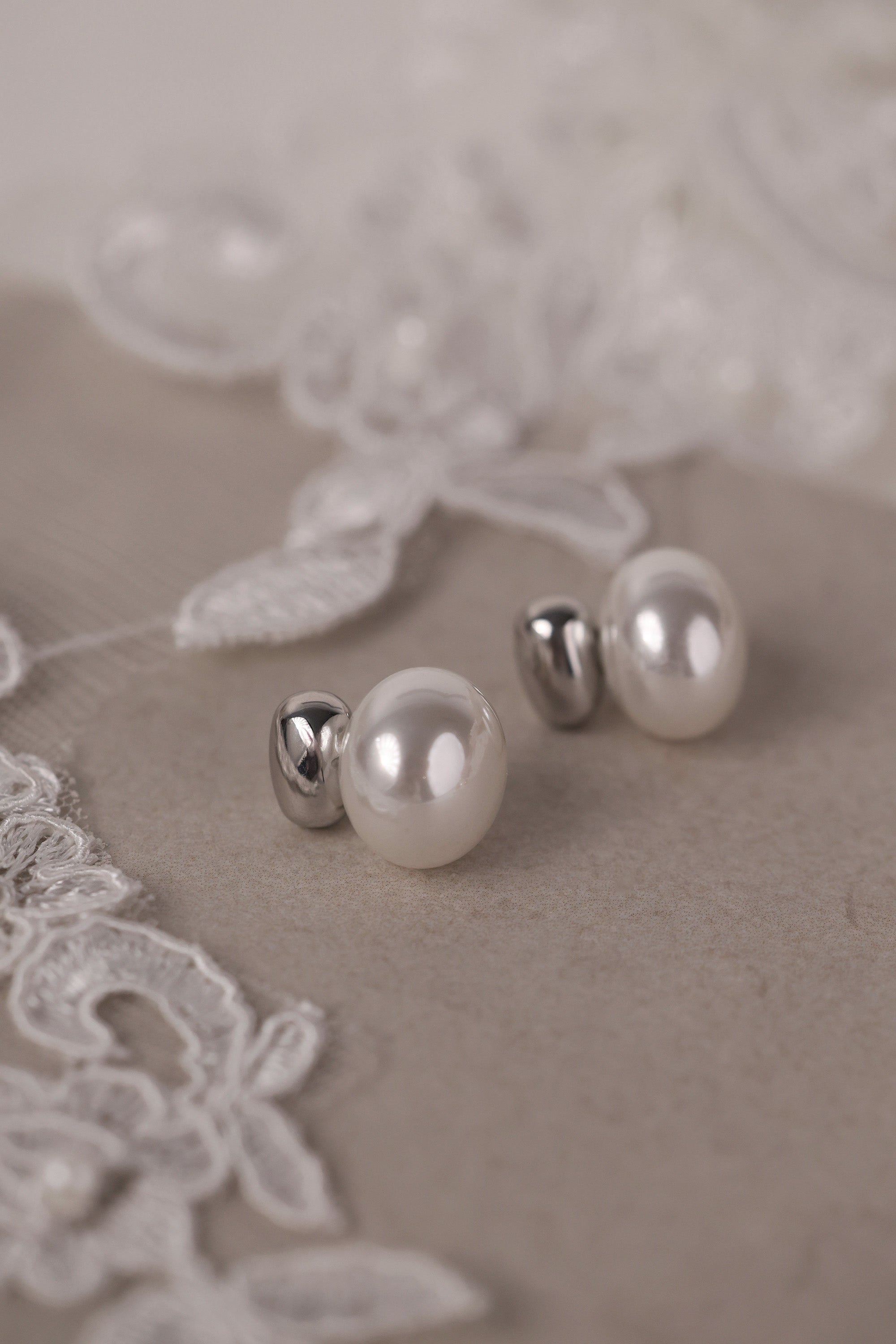 Stainless steel pearl stud earrings with a polished silver bead waterproof tarnish free bridemaid earrings