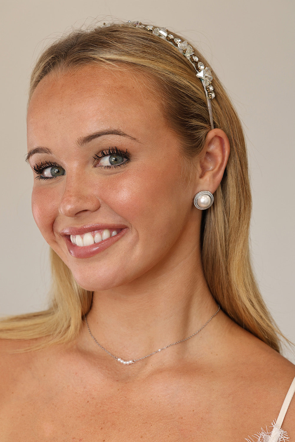 Silver beaded‑edge pearl stud earrings 