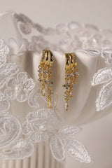Gold triple‑drop illusion earrings with sparkling stones -Anett Jewellery