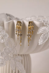 Gold triple‑drop illusion earrings with sparkling stones -Anett Jewellery