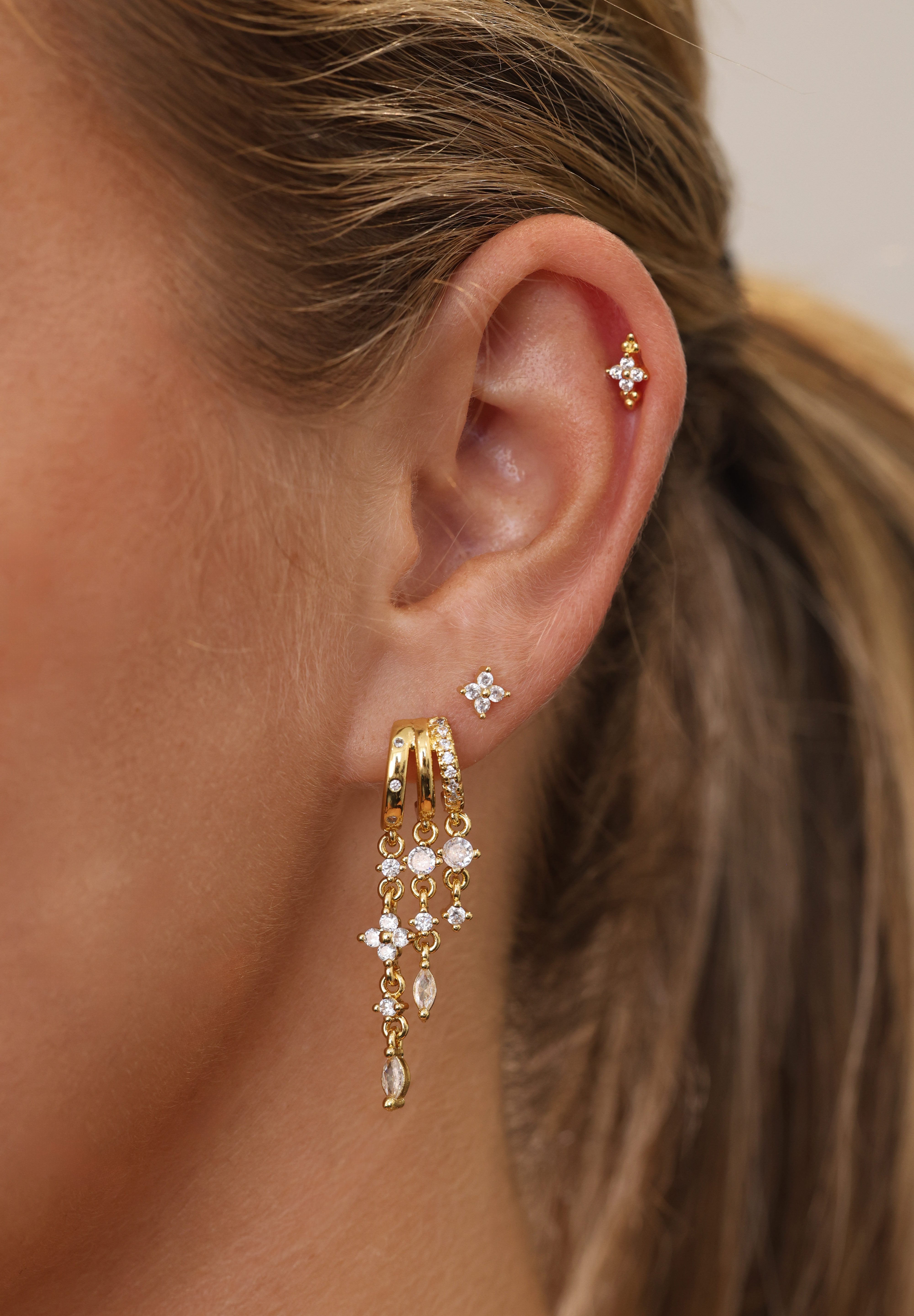 Gold triple‑drop illusion earrings with sparkling stones -Anett Jewellery