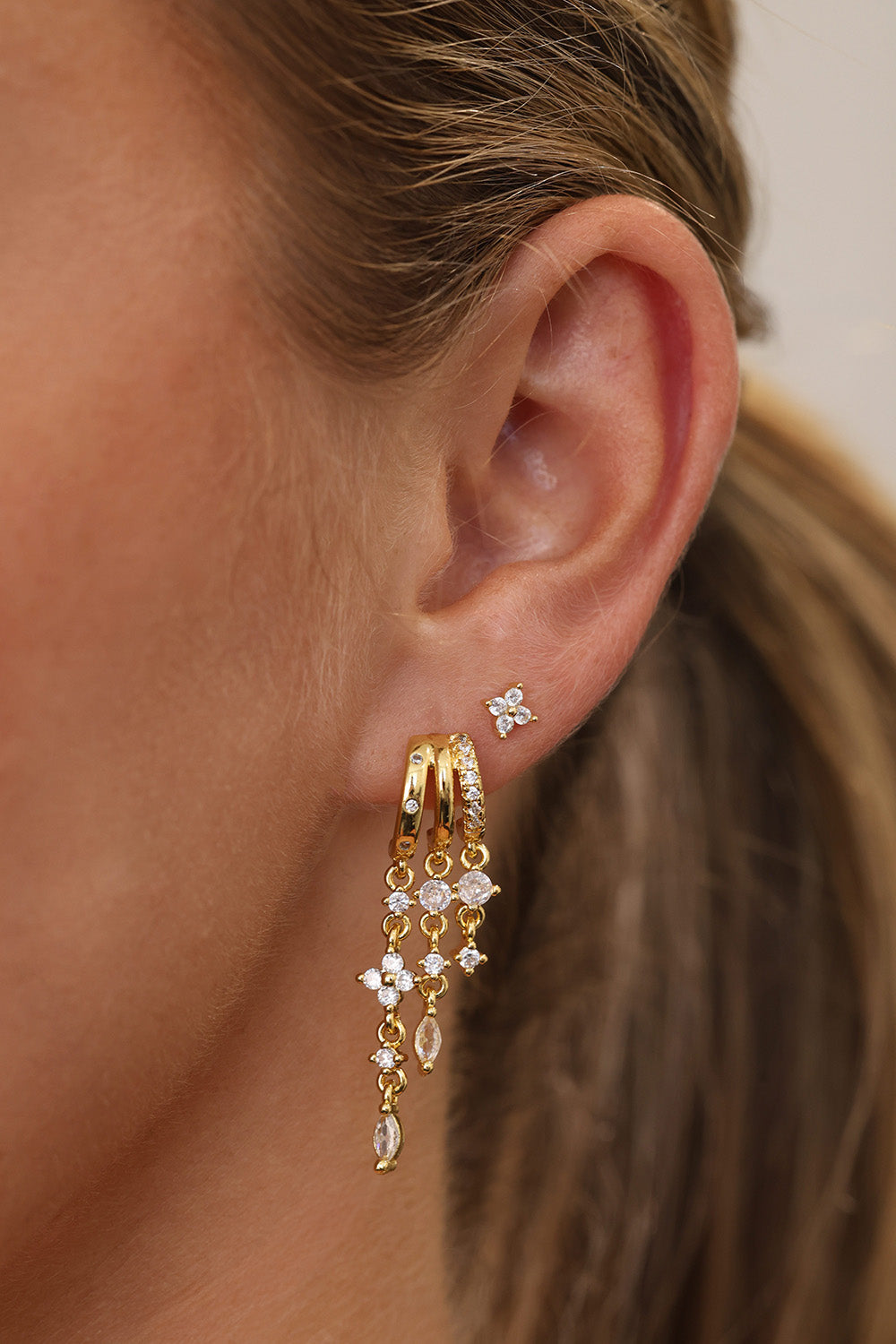 Gold triple‑drop illusion earrings with sparkling stones -Anett Jewellery
