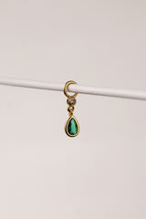 Gold teardrop bezel charm with emerald green gemstone hanging from a small hoop connector.