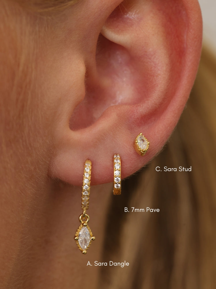 Size guide showing the Sara gold ear stack — A. Sara Dangle, B. 7mm Pave Huggie and C. Sara Stud on a model's ear