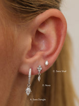 Size guide showing Sara silver ear stack — A. Sara Dangle, D. Nova and C. Sara Stud on a model's ear