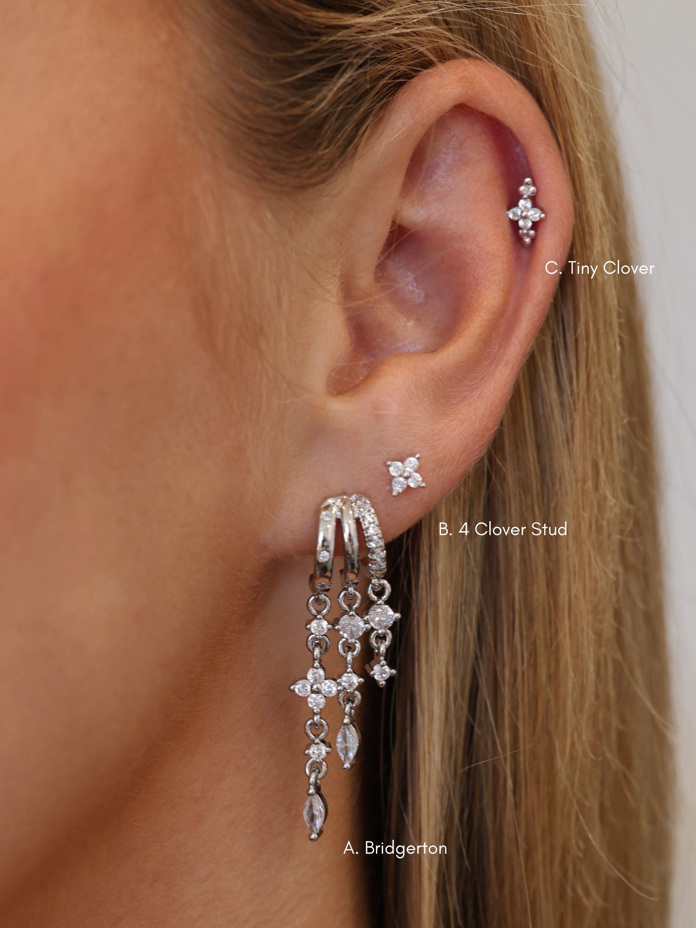 Silver triple‑drop illusion earrings with sparkling stones