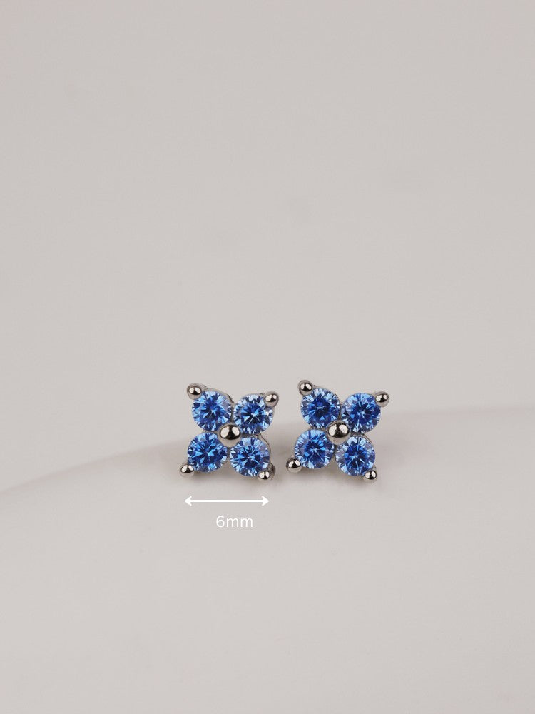 Four-leaf clover stud earrings with blue crystal detailing